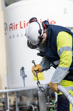 Technician filling a tank 02
